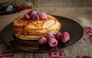 Pancakes  with raspberries and syrup