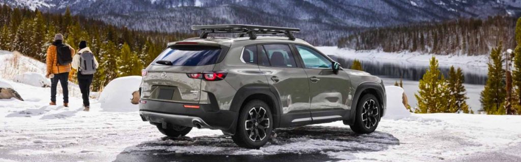 Exterior of a 2025 Mazda CX-50 parked in the snowy mountains